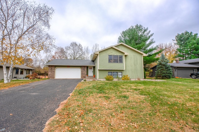 split level home featuring a garage and a front yard