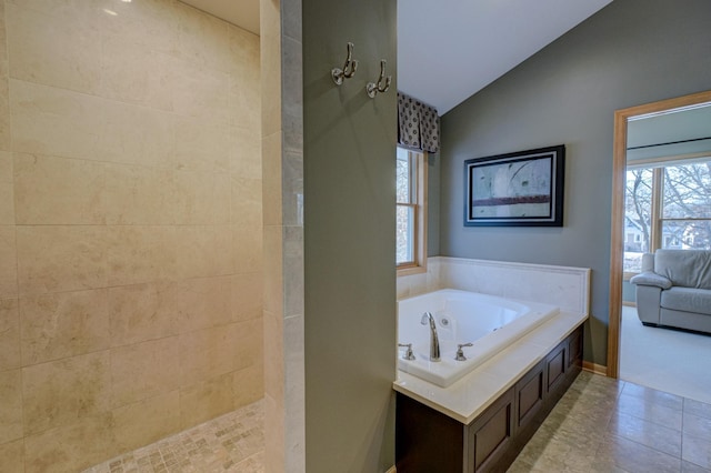 bathroom with independent shower and bath and vaulted ceiling