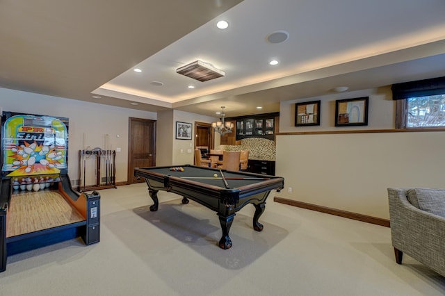 recreation room with light carpet, a tray ceiling, and billiards