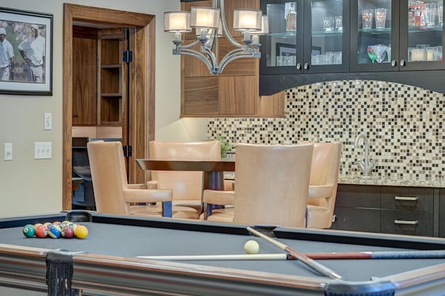 rec room with billiards and bar area