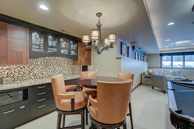 dining area with a notable chandelier