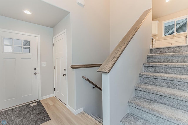 foyer entrance with light hardwood / wood-style flooring