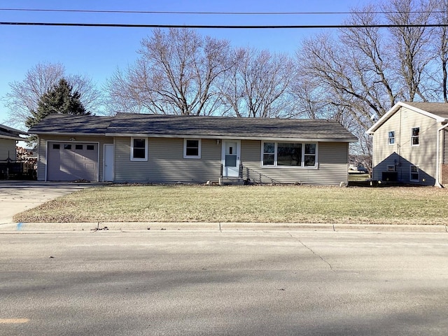 view of front of property with a garage and a front yard