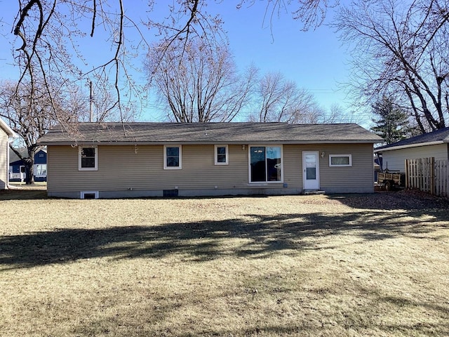 back of house with a yard