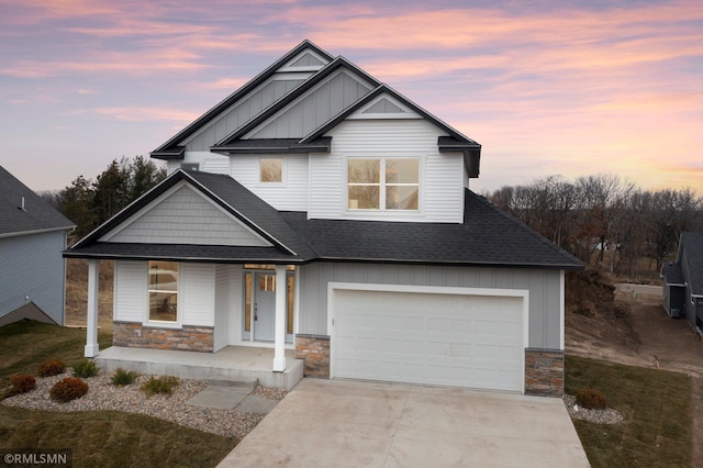 craftsman house featuring a porch and a garage