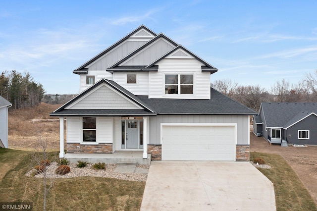 view of front facade with a porch and a garage