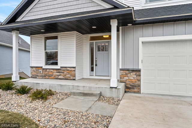 entrance to property with a porch and a garage