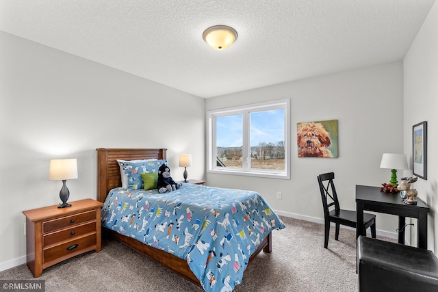 bedroom featuring carpet and a textured ceiling