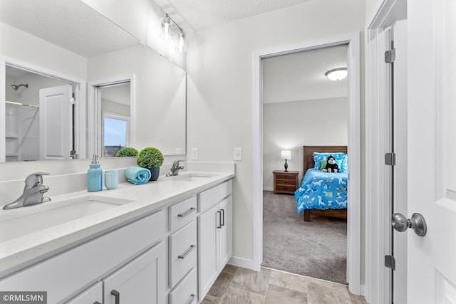 bathroom featuring vanity and a textured ceiling