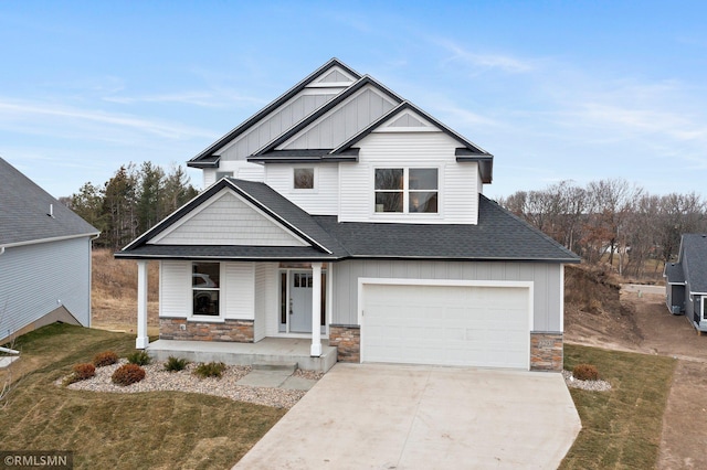 view of front of house with covered porch and a garage