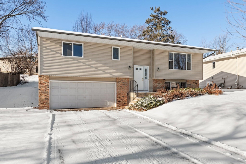 bi-level home featuring a garage