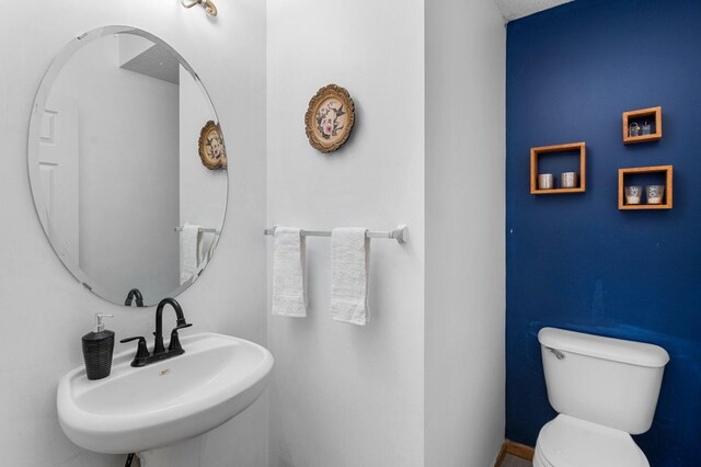 bathroom with sink and toilet