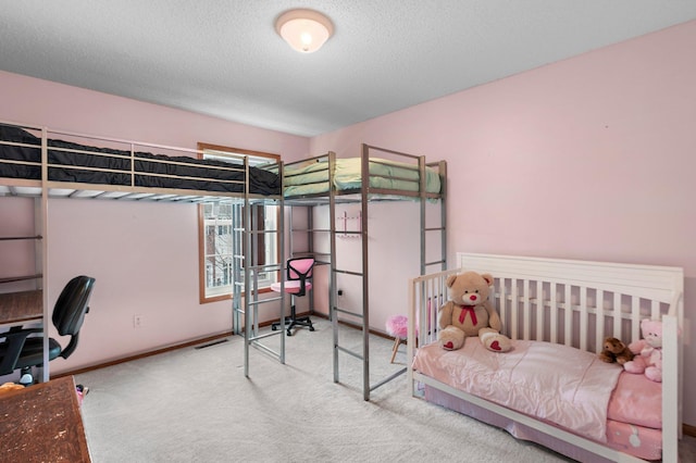 carpeted bedroom with a textured ceiling