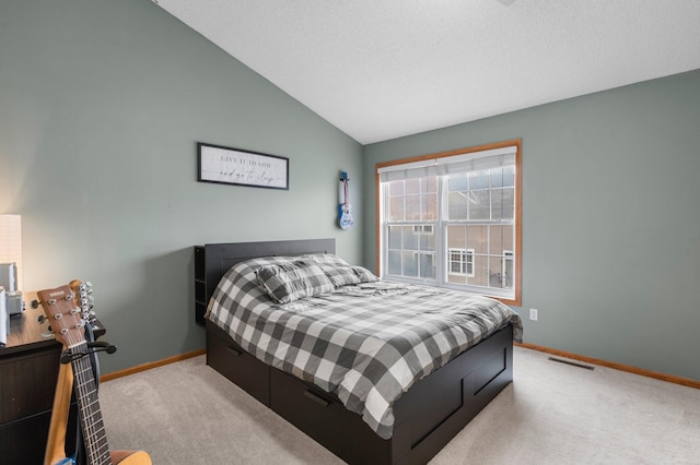 carpeted bedroom featuring vaulted ceiling