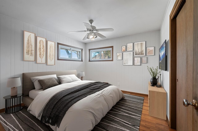 bedroom with hardwood / wood-style floors and ceiling fan