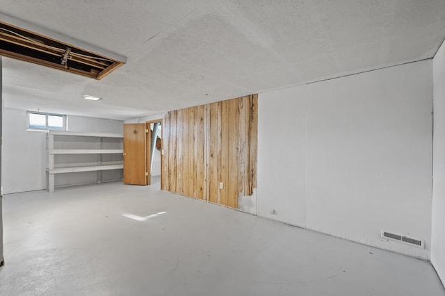 basement with wood walls