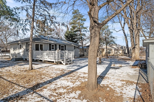 view of front facade with a wooden deck