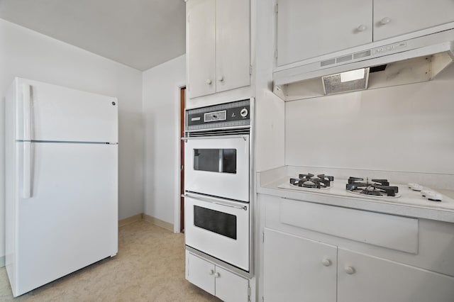 kitchen featuring white cabinetry and white appliances