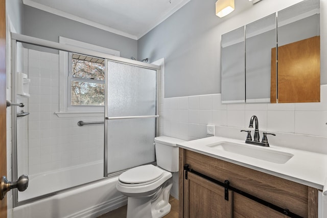 full bathroom with toilet, bath / shower combo with glass door, tile walls, vanity, and backsplash