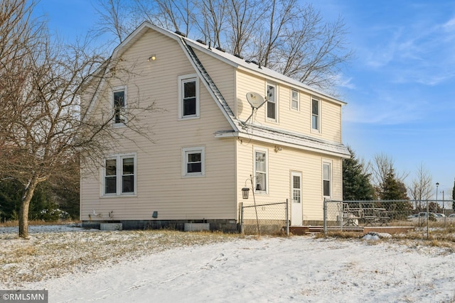 view of snow covered property