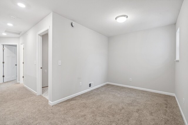 empty room with light colored carpet