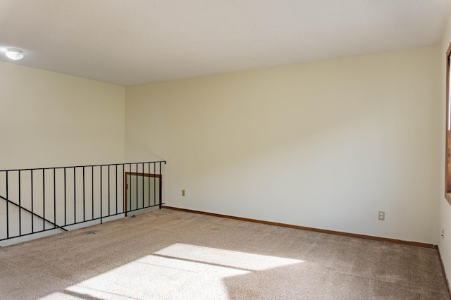 unfurnished room featuring carpet floors