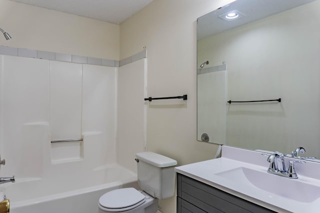 full bathroom featuring vanity, washtub / shower combination, and toilet