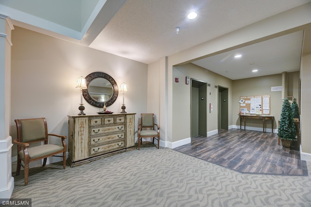 interior space featuring elevator and carpet