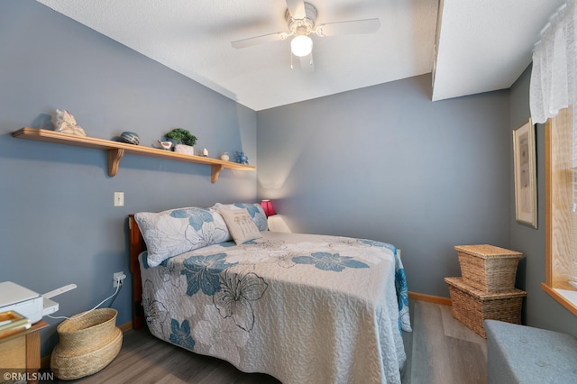 5650 Boone Ave N Unit 321, New Hope, MN 55428 - bedroom with wood finished floors, baseboards, ceiling fan, and lofted ceiling