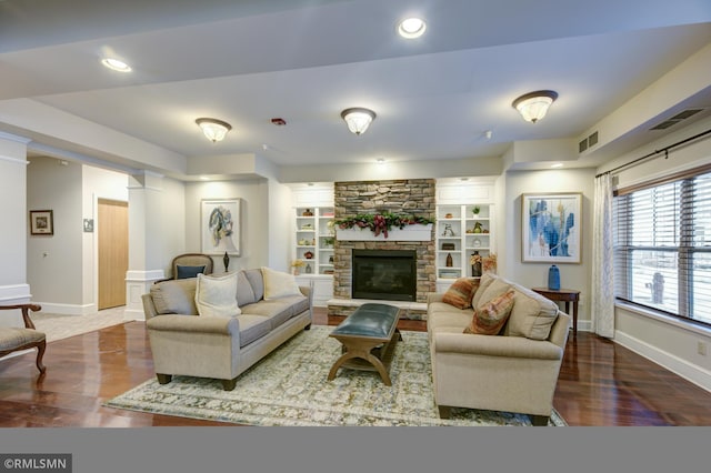 5650 Boone Ave N Unit 321, New Hope, MN 55428 - living room with baseboards, wood finished floors, a stone fireplace, and recessed lighting
