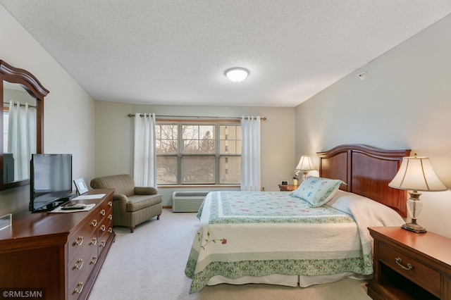 5650 Boone Ave N Unit 321, New Hope, MN 55428 - carpeted bedroom featuring a textured ceiling and an AC wall unit
