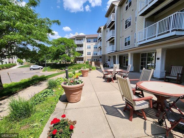 5650 Boone Ave N Unit 321, New Hope, MN 55428 - view of patio / terrace featuring outdoor dining area