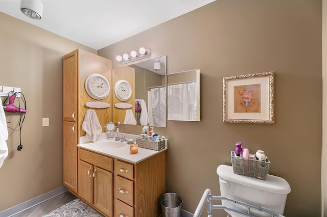5650 Boone Ave N Unit 321, New Hope, MN 55428 - bathroom featuring vanity, wood finished floors, and curtained shower
