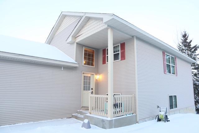 view of snow covered house