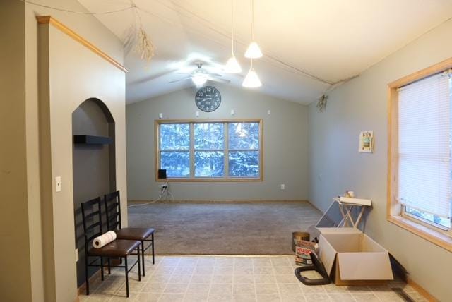 sitting room with light colored carpet, vaulted ceiling, and ceiling fan