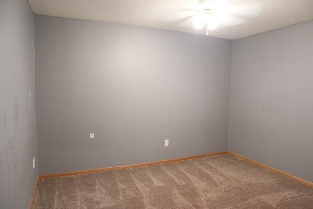 empty room with carpet flooring