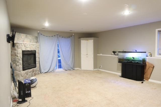 interior space with a fireplace and baseboards