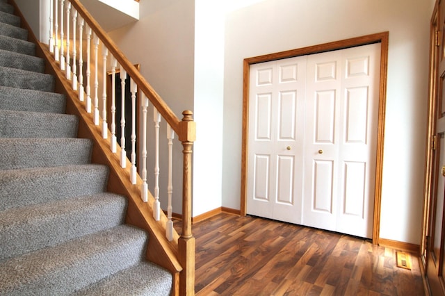 stairs with hardwood / wood-style flooring