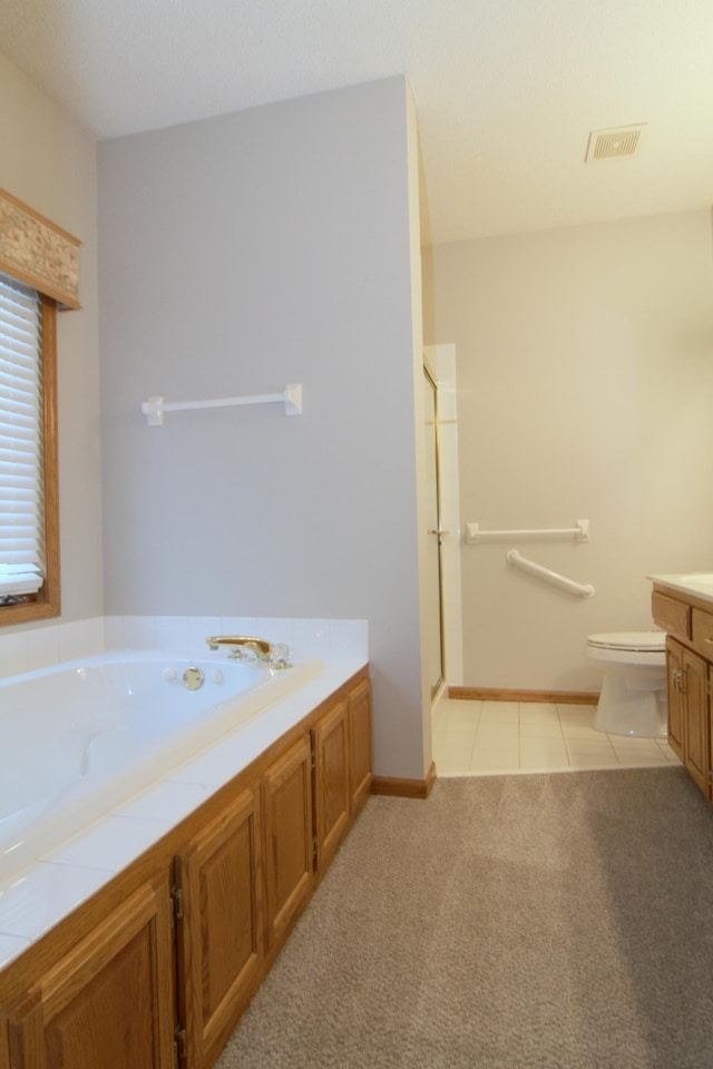 full bathroom with separate shower and tub, tile patterned floors, vanity, and toilet