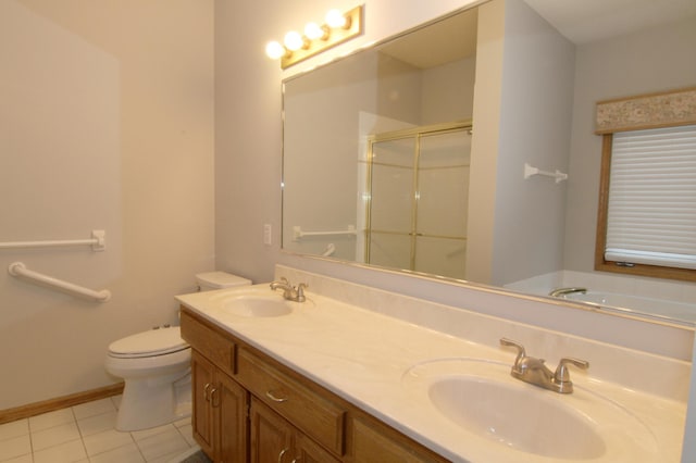 full bathroom with independent shower and bath, vanity, tile patterned floors, and toilet