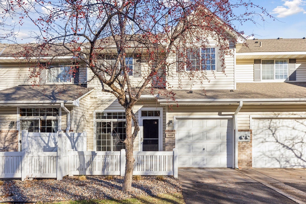 townhome / multi-family property with a garage