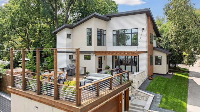 back of property featuring a wooden deck