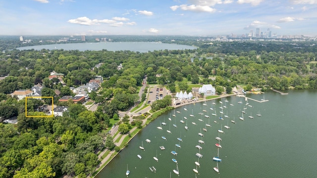 birds eye view of property with a water view