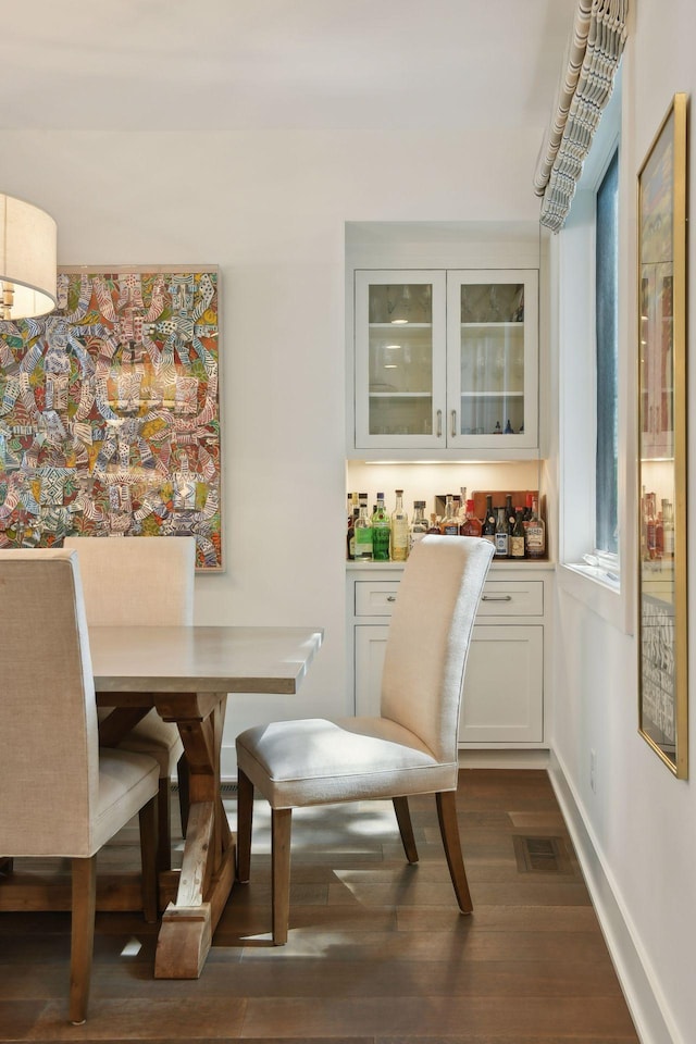 dining room with dark wood-type flooring