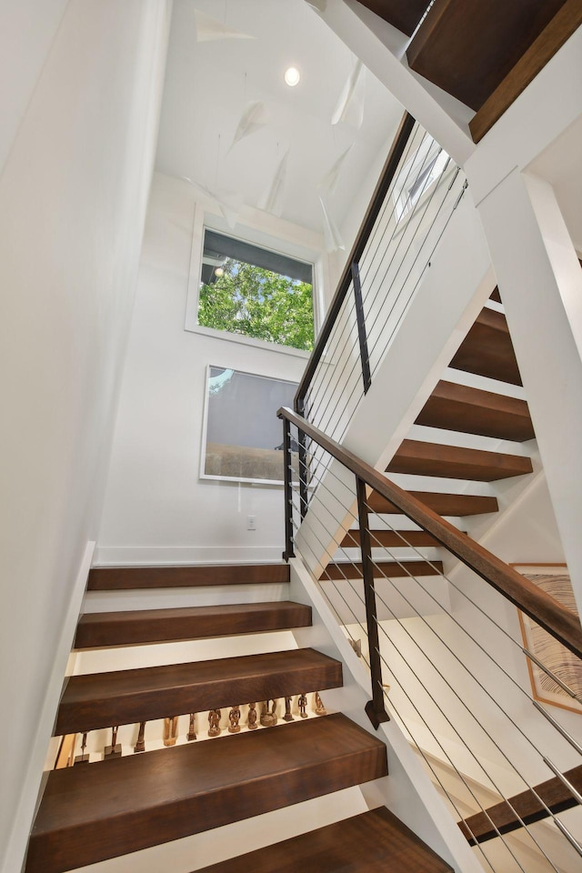 stairway featuring hardwood / wood-style floors