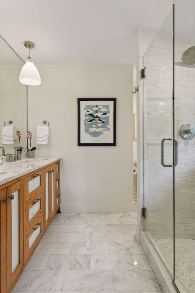 bathroom featuring vanity and a shower with shower door