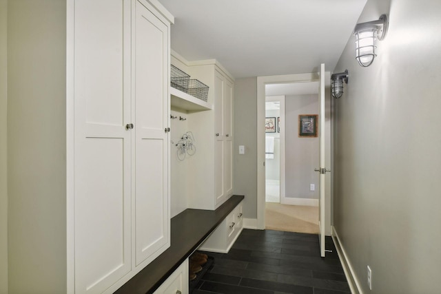 mudroom with dark hardwood / wood-style floors