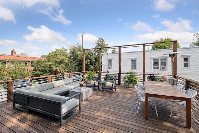 wooden terrace with outdoor lounge area