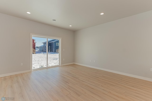 unfurnished room featuring light hardwood / wood-style floors