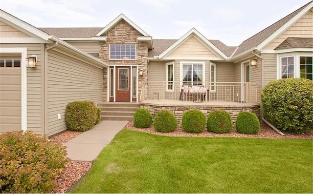 entrance to property featuring a yard